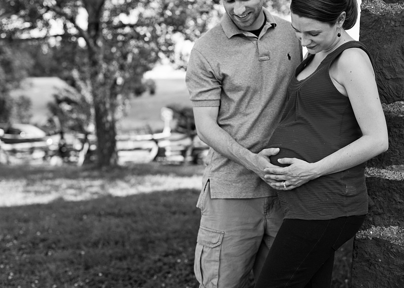 parents looking at baby belly