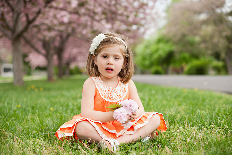 four year old girl holding flowers