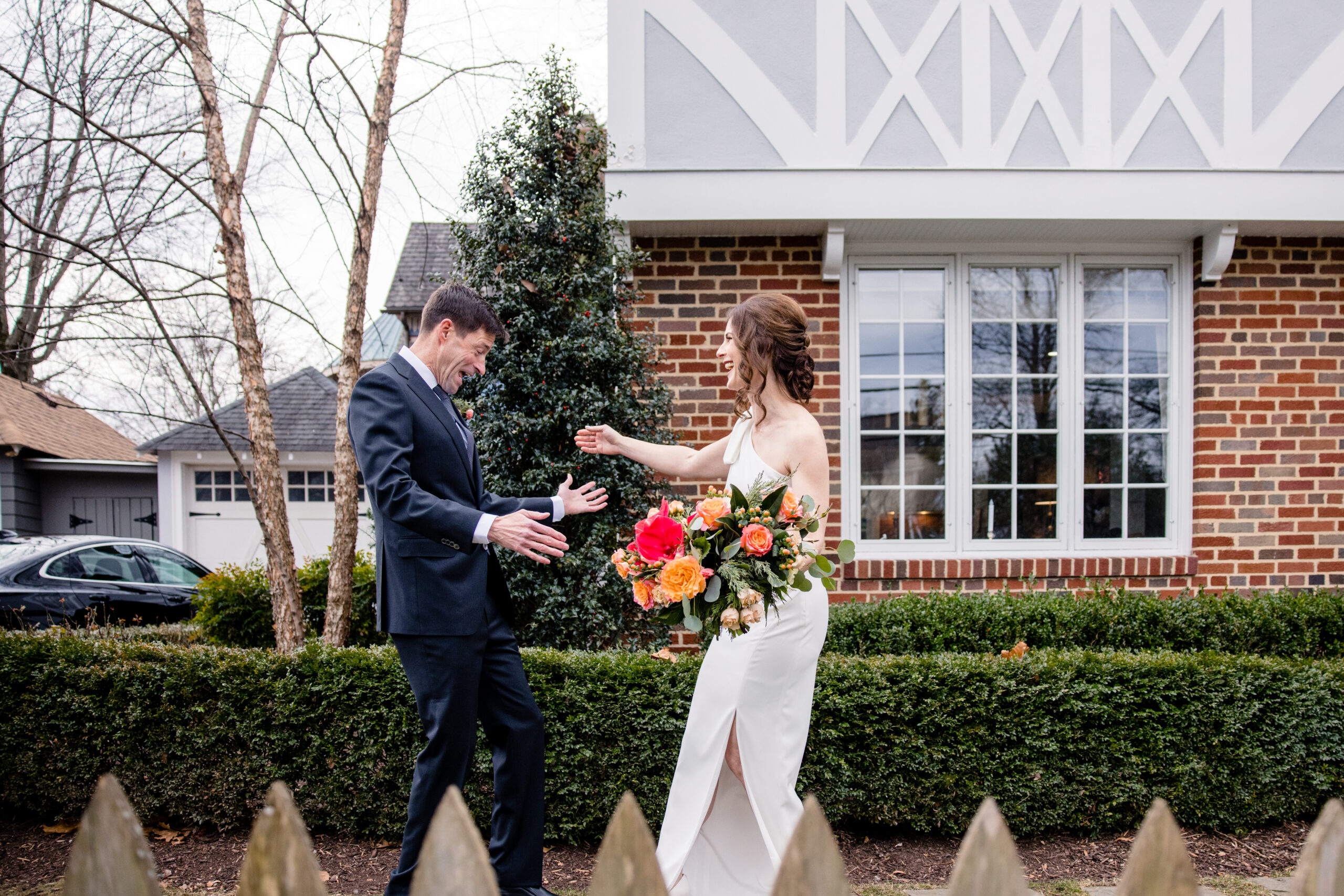 a man excited to see his partner in her wedding dress as their share a first look together