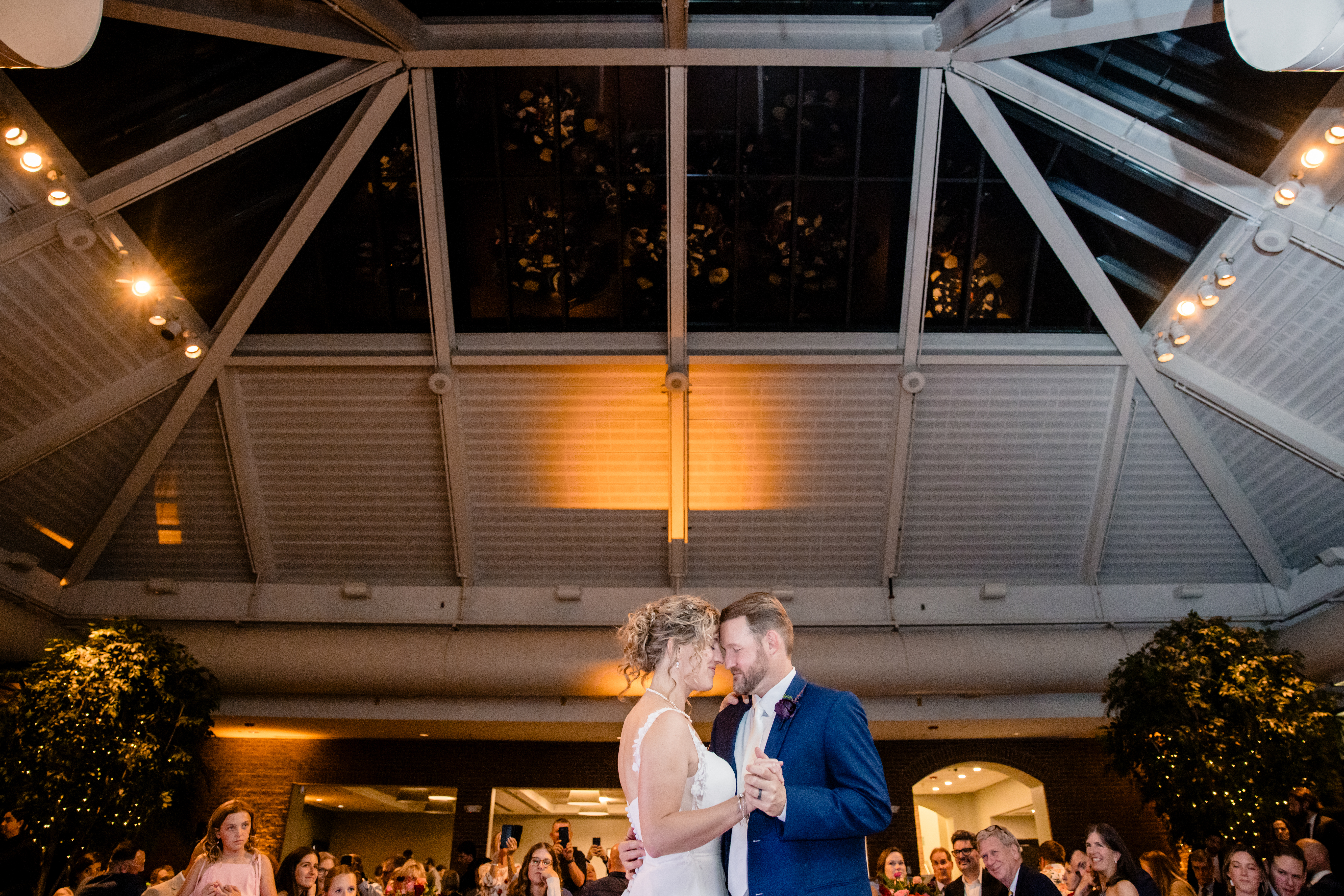 a couple dancing in The Atrium at Meadowlark Botanical Gardens at their wedding reception 