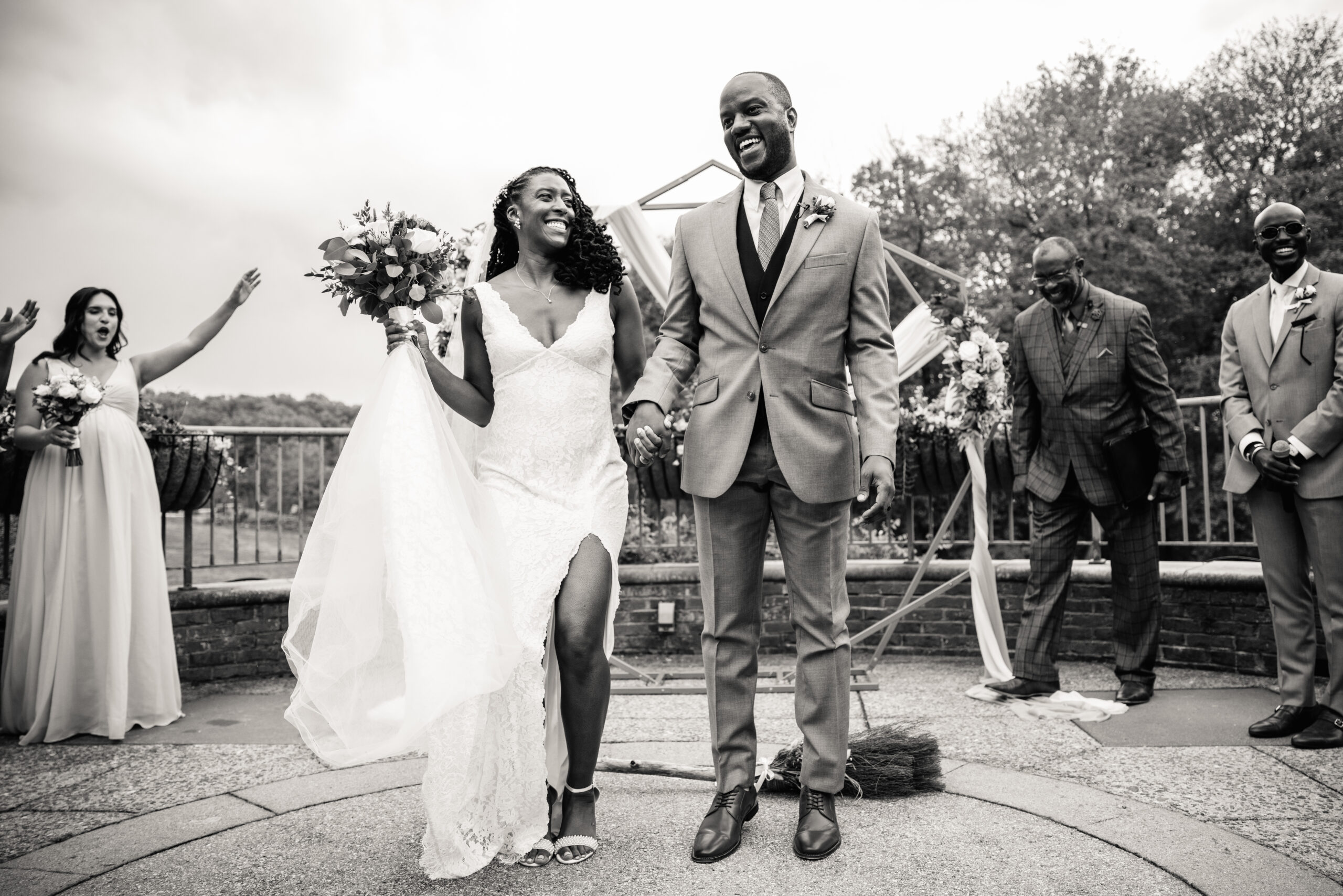 a couple having their wedding ceremony on a terrace at a botanical garden