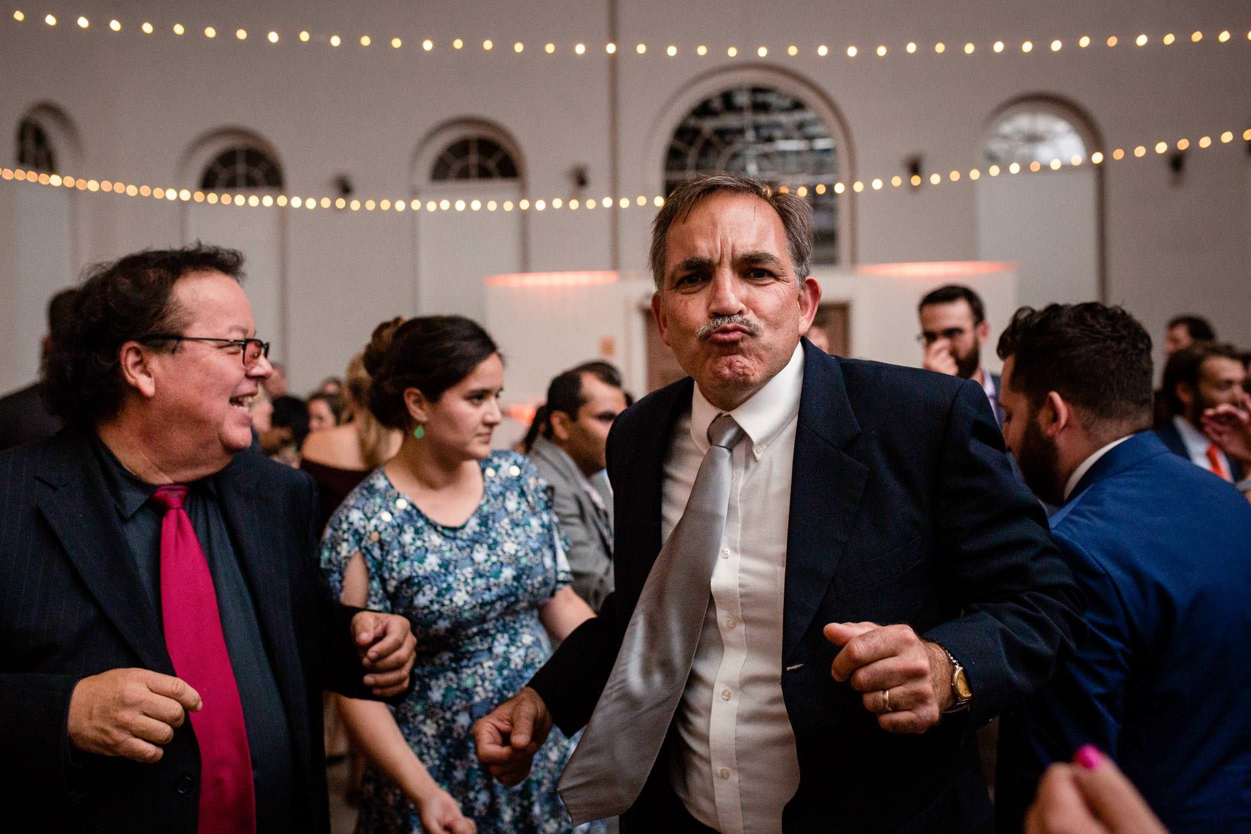 family members dancing at a wedding reception