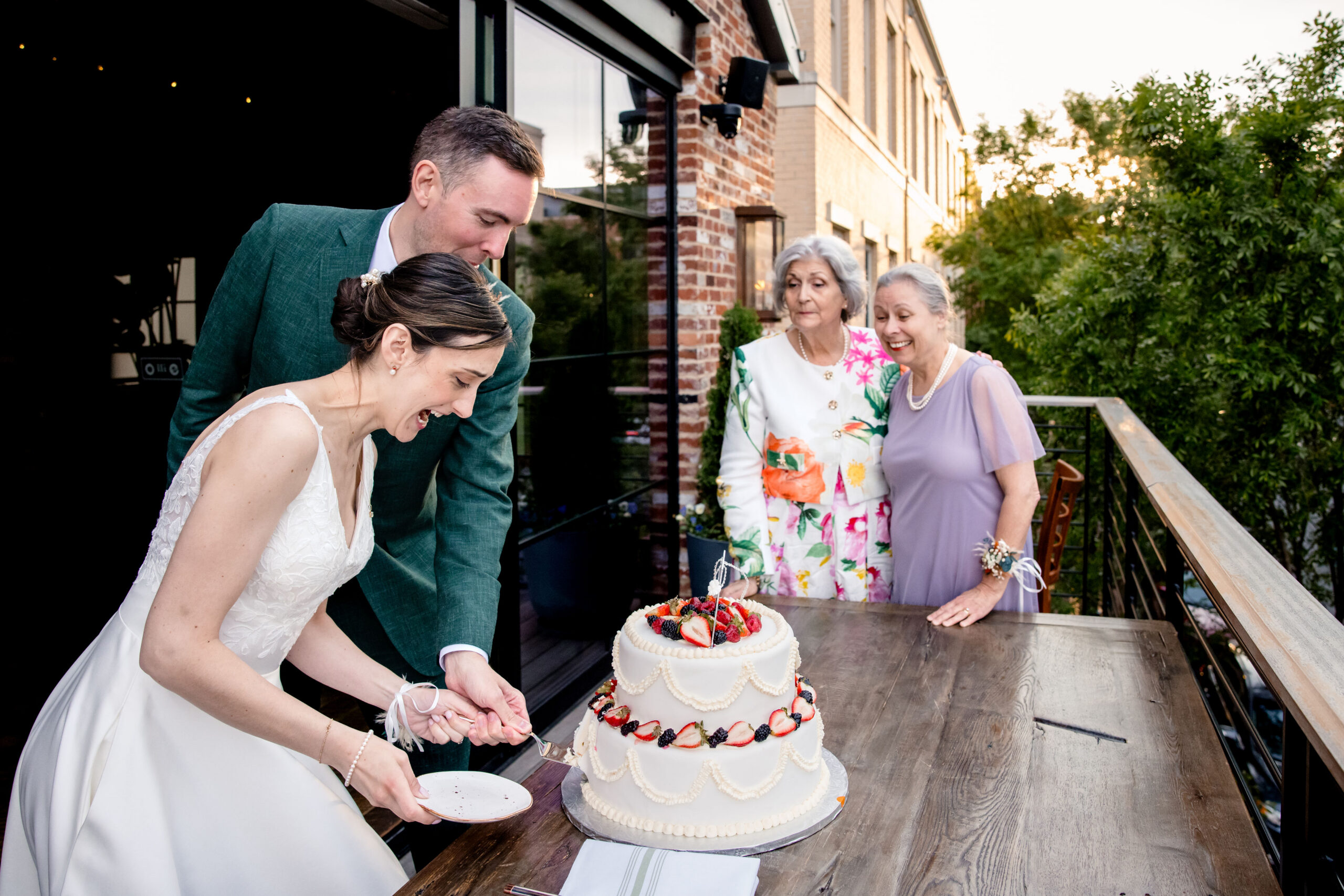 a bride and groom cutting a cake together on the day of ther wedding 