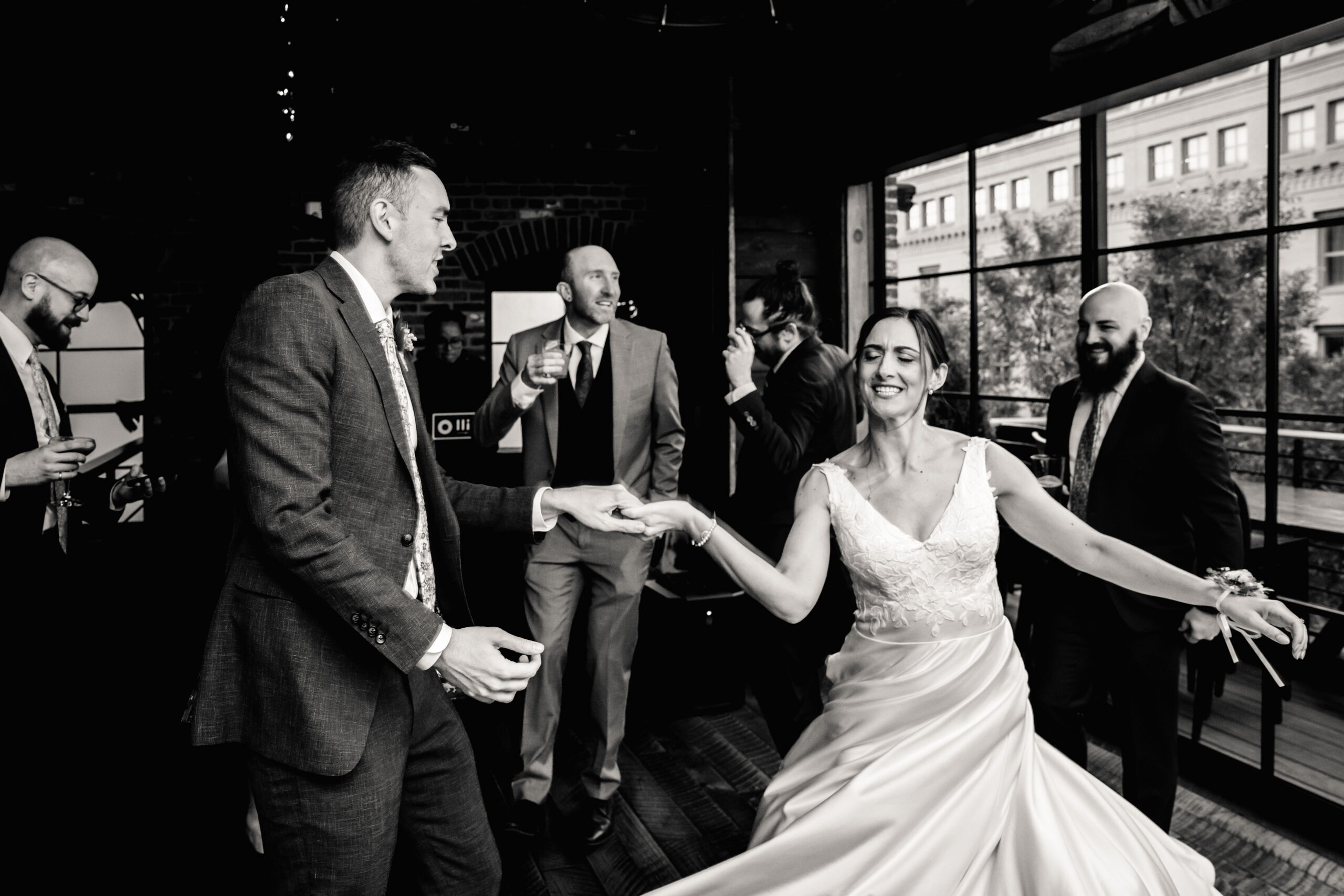 a bride and groom dancing with each other at their wedding reception at cooper mill 