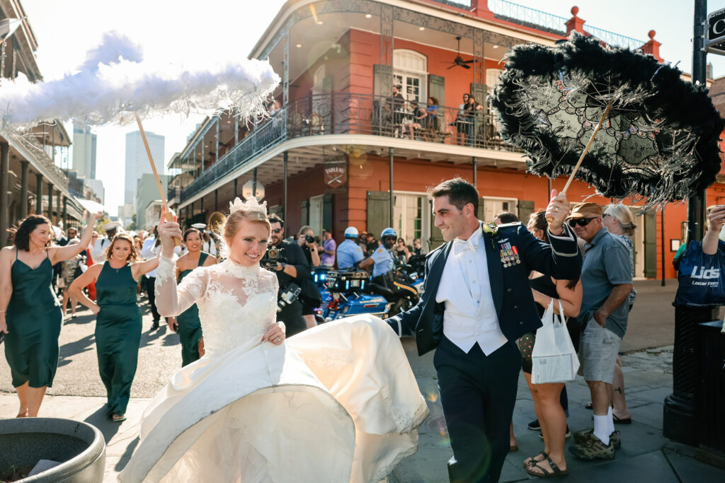 Newlyweds during a procession through the streets after their wedding 